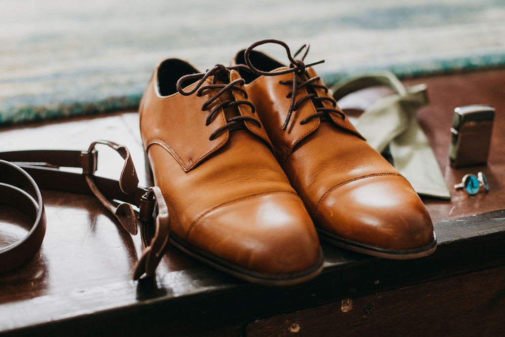 brown leather shoes and groom details
