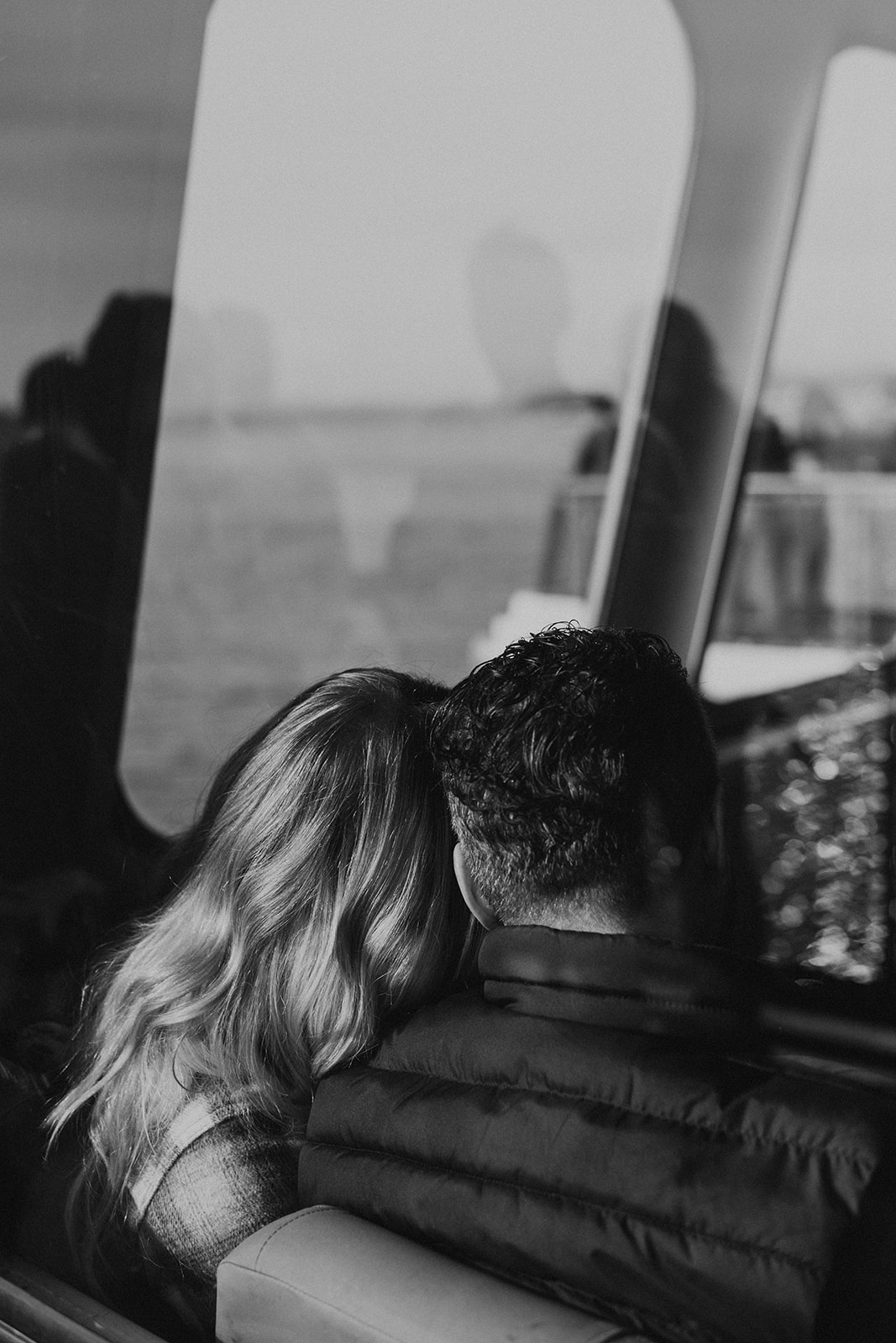 black and white photo of couple on Seattle ferry during fall PNW engagement photo session
