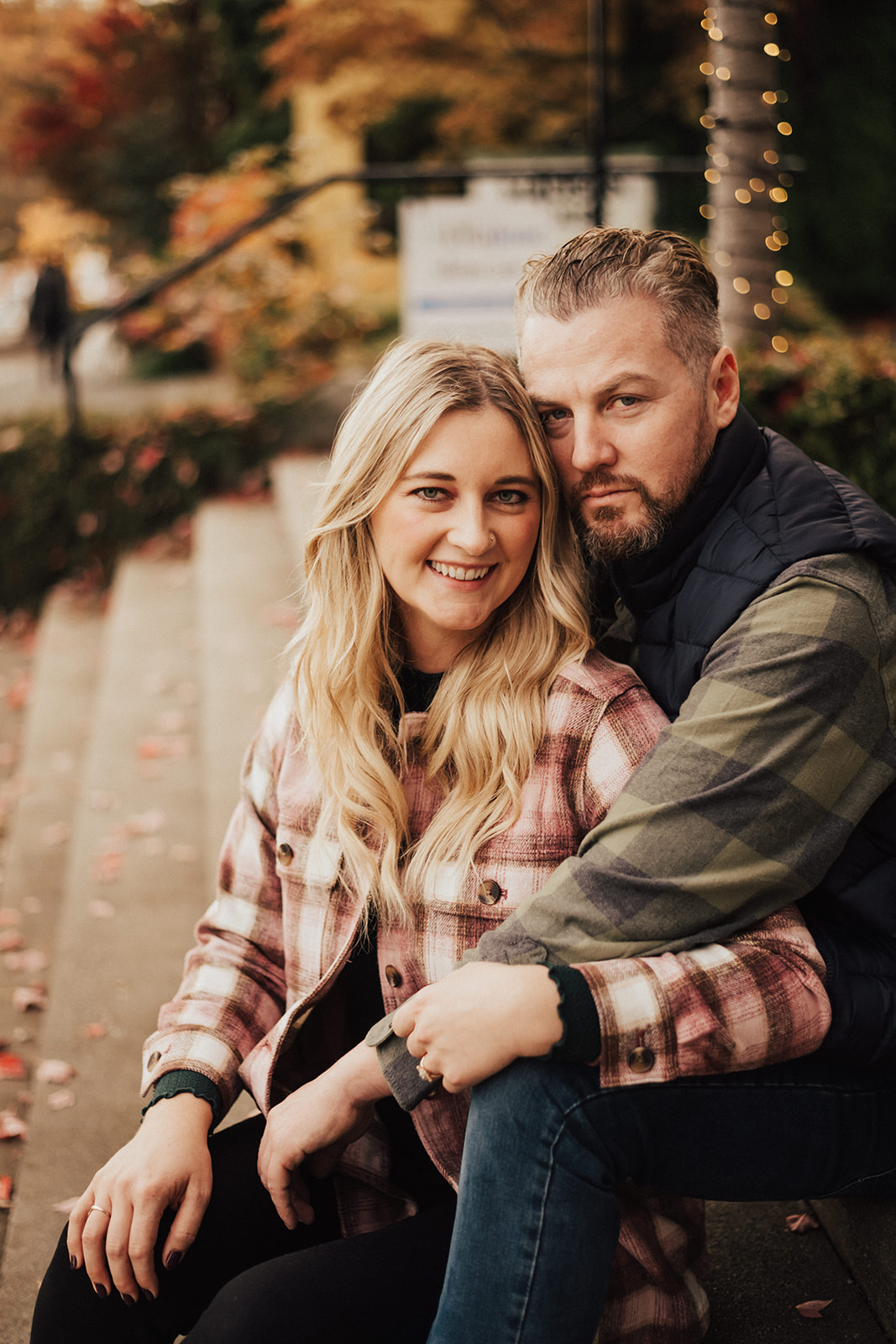 fall engagement photo session with couple sitting on steps