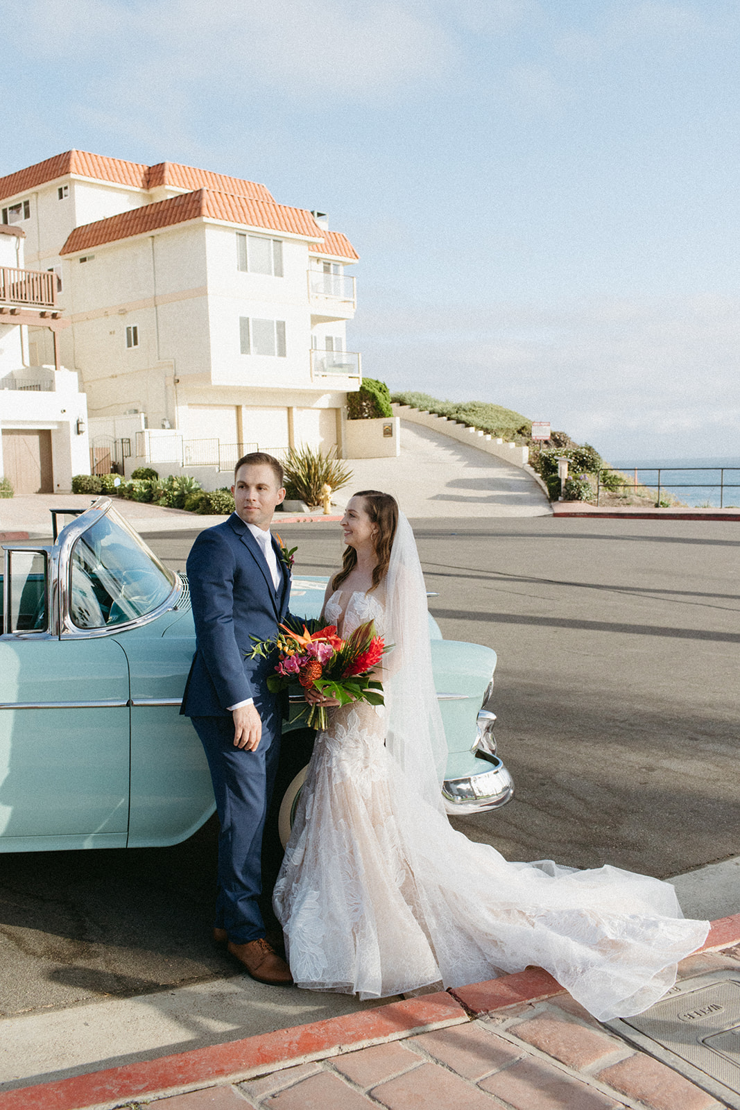 bride and groom portrait shots with vintage blue chevy convertible