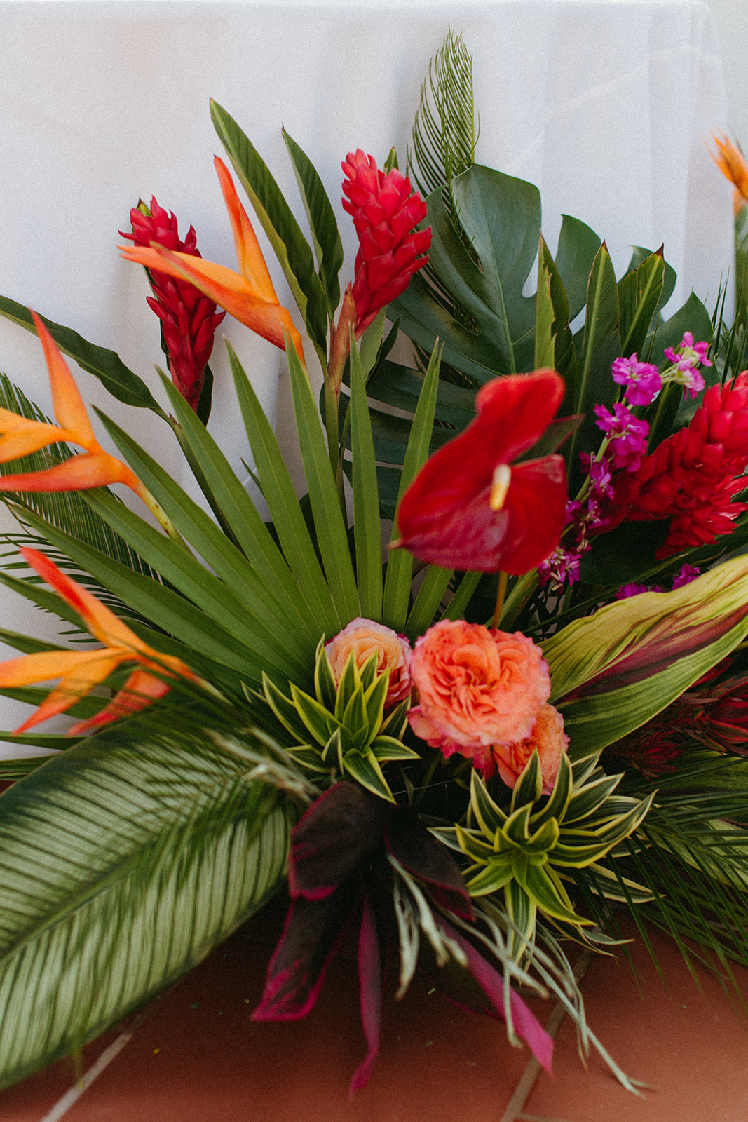 tropical floral arrangement for sweetheart table