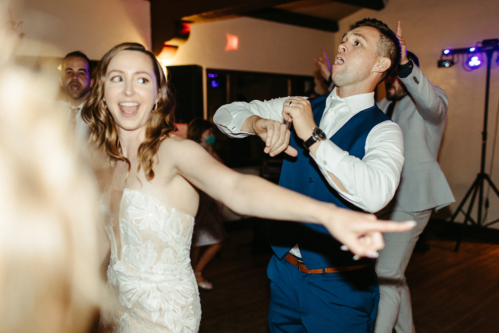 bride and groom dancing during wedding reception 