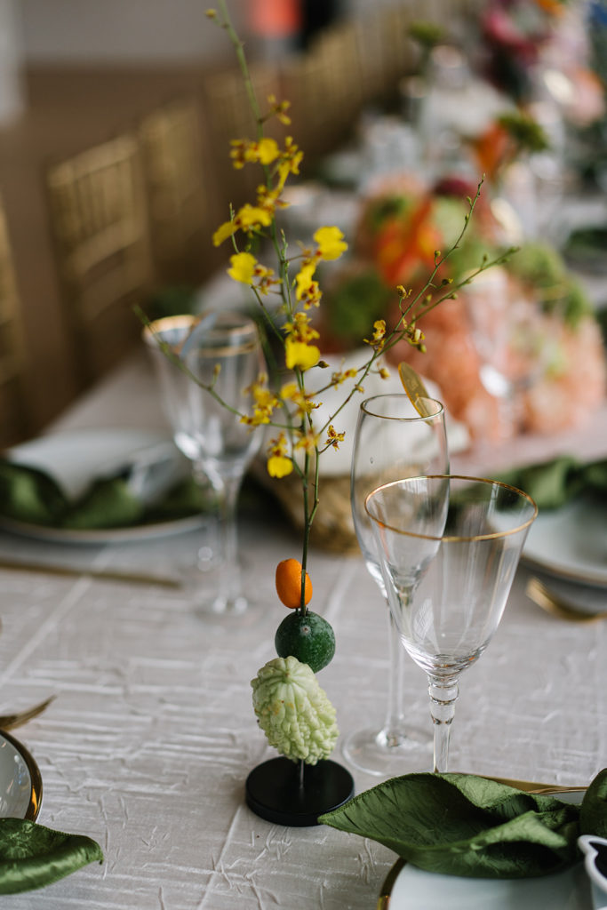 unique wedding reception table centerpiece with fruit and gourds