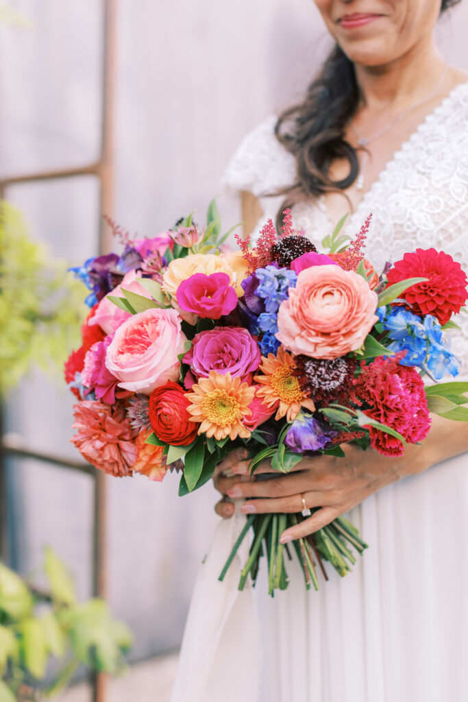 bright rainbow colored bridal bouquet for fiesta themed wedding at The Grass Room