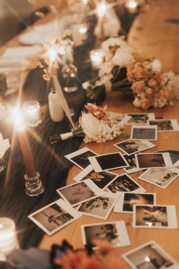 table filled with polaroid pictures 